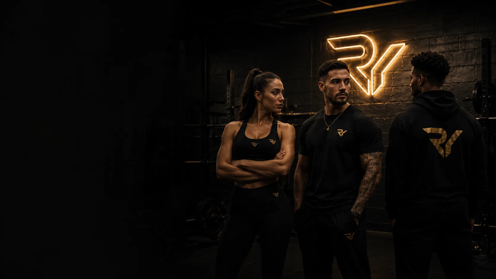 Three athletes in Resurrect You apparel beneath a neon RY sign